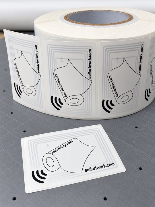 Sailventory NFC tags on a roll, with one loose tag in front